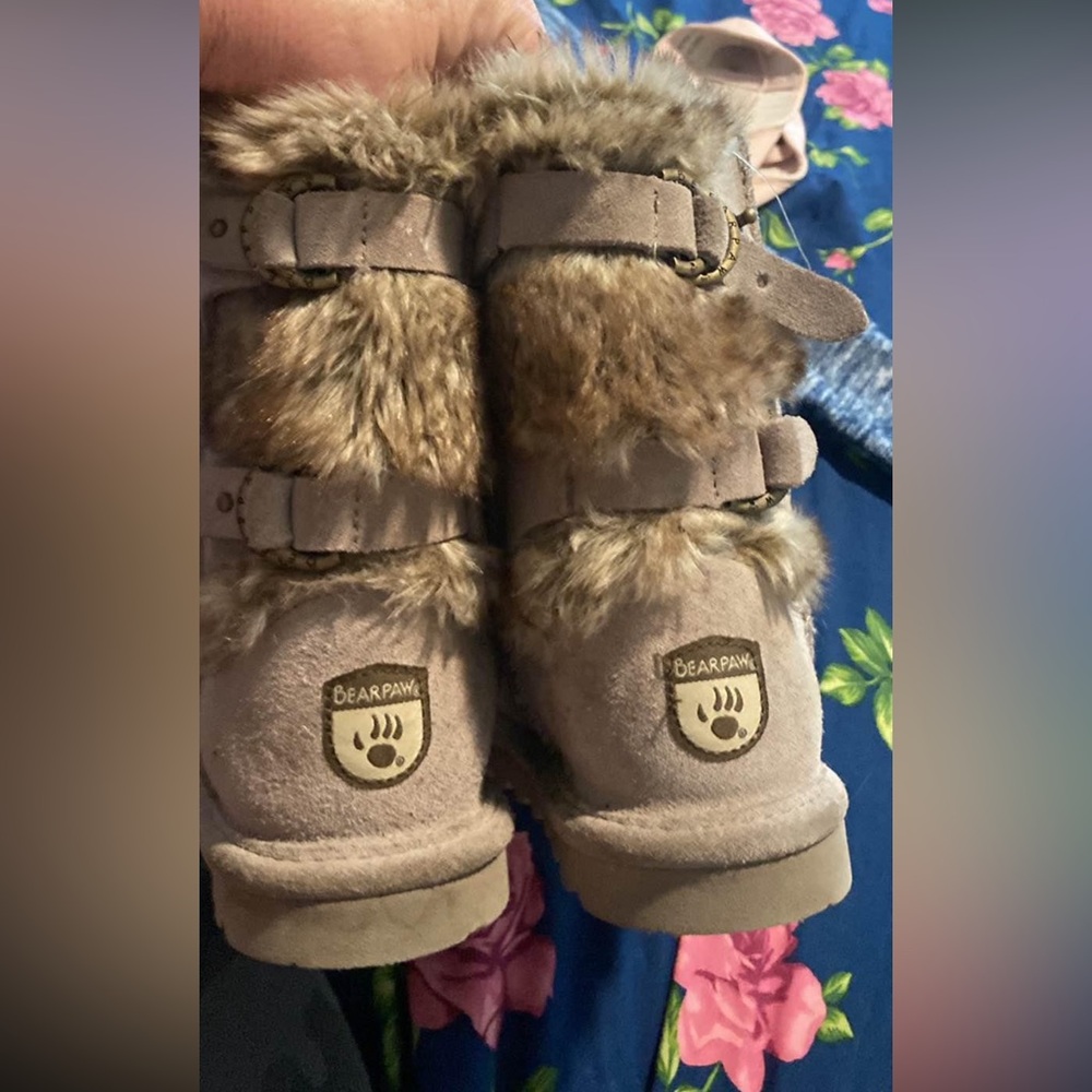 Girls you size 3 bearpaw boots. Never worn outside of the house.